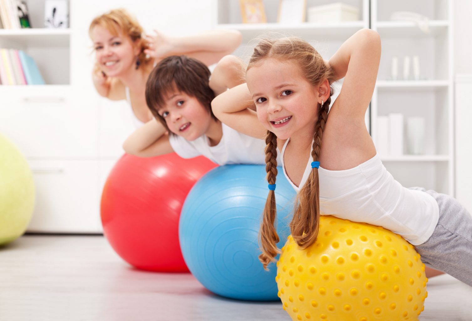 children on exercise balls